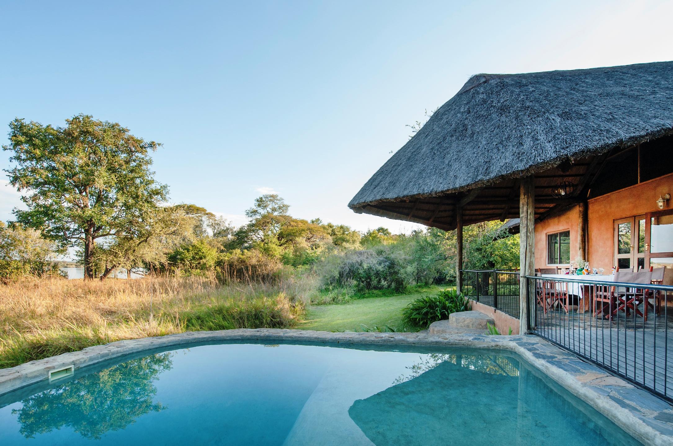 exterior showing pool and kiddy fencing